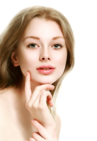 Beautiful woman face close up portrait young. Isolated on white. Studio shot.の写真素材