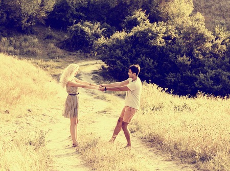 Young and beautiful couple in love together. Summer time. Outdoor shot.の写真素材