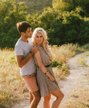 Young and beautiful couple in love together. Summer time. Outdoor shot.の写真素材