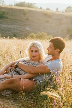 Young and beautiful couple in love together. Summer time. Outdoor shot.の写真素材