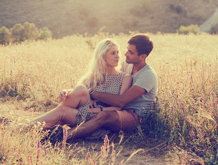 Young and beautiful couple in love together. Summer time. Outdoor shot.の写真素材