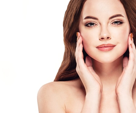 Beautiful woman face on white with sexy lipsの写真素材