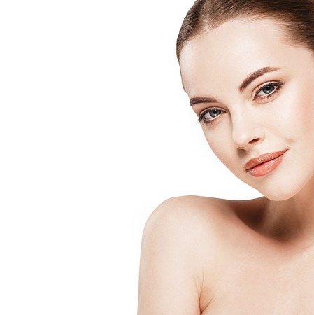 Beautiful woman face close up studio. Isolated on whiteの写真素材