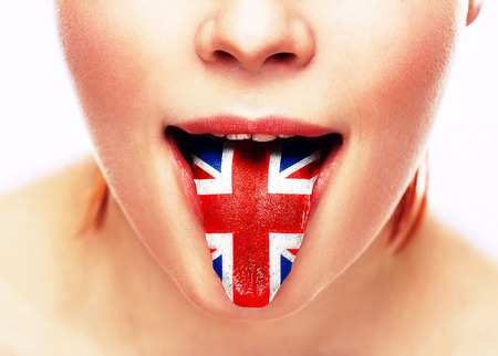 English language tongue open mouth with flag Britain woman face. Studio.の写真素材