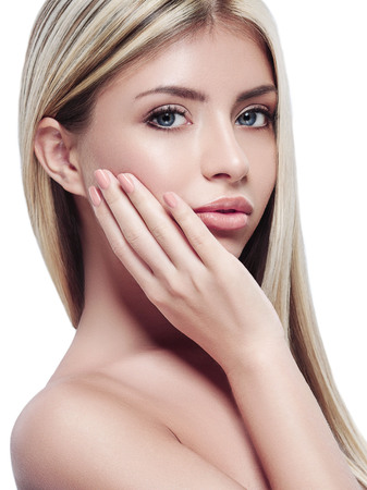 Beautiful woman face with blond hair on whiteの写真素材