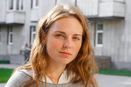 Portrait of smiling young and happy woman with freckles.の写真素材
