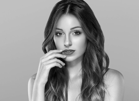 Beautiful woman skin care healthy portrait black and white. Studio shot. Isolated on white.の写真素材