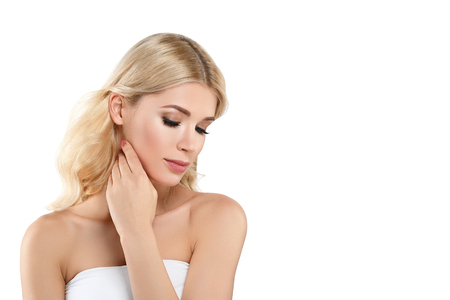 Beautiful Woman Blond face Portrait. Beautiful Spa model Girl with Perfect Fresh Clean Skin. Blonde female smiling. Youth and Skin Care Concept Red Lipstick and nails manicure.の写真素材