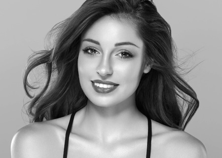 Beautiful woman skin care healthy portrait black and white. Studio shot. Isolated on white.の写真素材