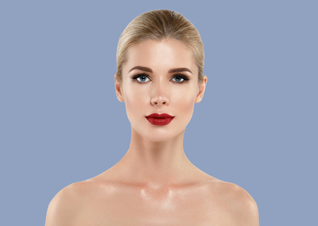 Woman cosmetic closeup beauty portrait, for salon beautiful people and healthy care skin and hair over blue color backgroundの写真素材