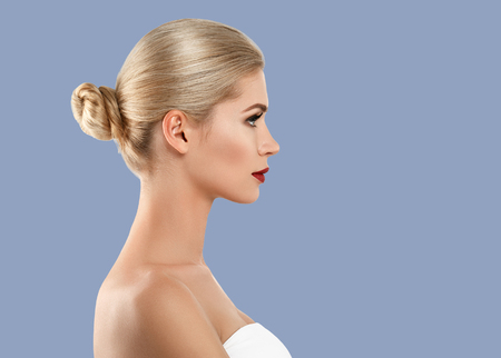 Woman cosmetic closeup beauty portrait, for salon beautiful people and healthy care skin and hair over blue color backgroundの写真素材