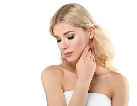 Beautiful Woman Blond face Portrait. Beautiful Spa model Girl with Perfect Fresh Clean Skin. Blonde female smiling. Youth and Skin Care Concept Red Lipstick and nails manicure.の写真素材