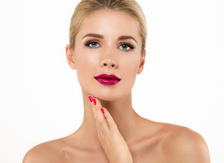 Woman nail manicure lipstick same color beauty portrait beautiful care. Isolated in white.の写真素材