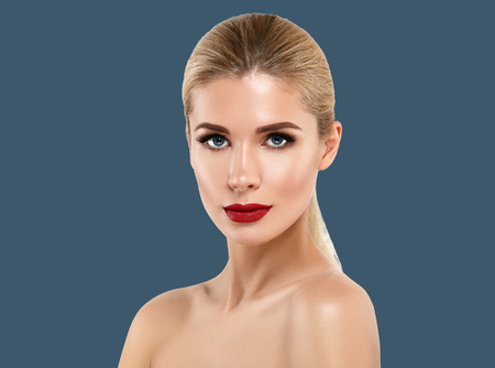 Woman cosmetic closeup beauty portrait, for salon beautiful people and healthy care skin and hair over blue color backgroundの写真素材