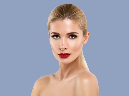 Woman cosmetic closeup beauty portrait, for salon beautiful people and healthy care skin and hair over blue color backgroundの写真素材