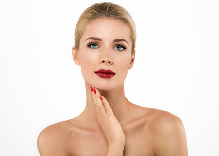 Woman nail manicure lipstick same color beauty portrait beautiful care. Isolated in white.の写真素材