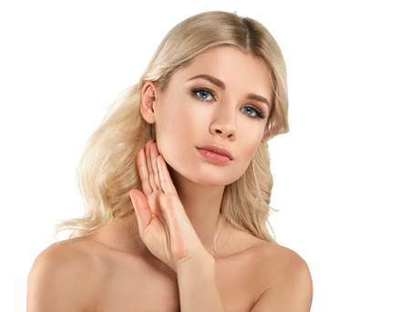Beautiful Woman Blond face Portrait. Beautiful Spa model Girl with Perfect Fresh Clean Skin. Blonde female smiling. Youth and Skin Care Concept Red Lipstick and nails manicure.の写真素材