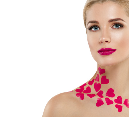 Valentine Day Heart Pink Beauty Woman face Portrait Beautiful Spa model Girl with Perfect Fresh Clean Skin. Blonde model smiling perfect makeup. Isolated on a white backgroundの写真素材