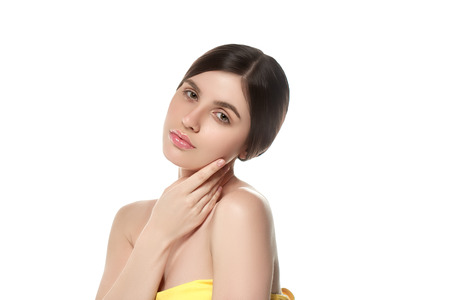 Beautiful Woman Face Portrait Beauty Skin Care Concept Beautiful beauty young female model girl touching her face skin cheeks hands fingers. Fashion Beauty Model isolated on whiteの写真素材