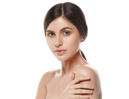 Beautiful Woman Face Portrait Beauty Skin Care Concept Beautiful beauty young female model girl touching her face skin cheeks hands fingers. Fashion Beauty Model isolated on whiteの写真素材