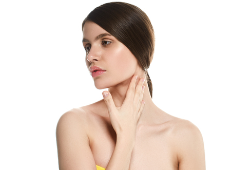 Beautiful Woman Face Portrait Beauty Skin Care Concept Beautiful beauty young female model girl touching her face skin cheeks hands fingers. Fashion Beauty Model isolated on whiteの写真素材