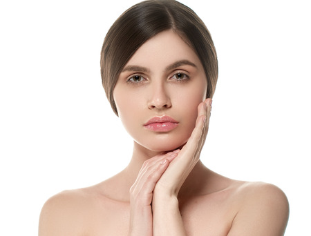 Beautiful Woman Face Portrait Beauty Skin Care Concept Beautiful beauty young female model girl touching her face skin cheeks hands fingers. Fashion Beauty Model isolated on whiteの写真素材