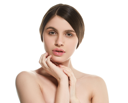 Beautiful Woman Face Portrait Beauty Skin Care Concept Beautiful beauty young female model girl touching her face skin cheeks hands fingers. Fashion Beauty Model isolated on whiteの写真素材