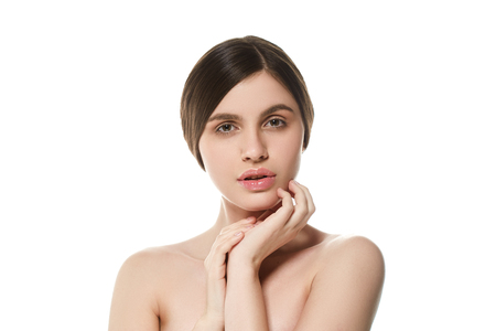 Beautiful Woman Face Portrait Beauty Skin Care Concept Beautiful beauty young female model girl touching her face skin cheeks hands fingers. Fashion Beauty Model isolated on whiteの写真素材