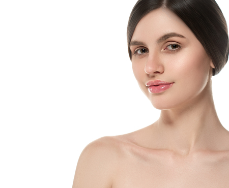 Beautiful Woman Face Portrait Beauty Skin Care Concept Beautiful beauty young female model girl touching her face skin cheeks hands fingers. Fashion Beauty Model isolated on whiteの写真素材