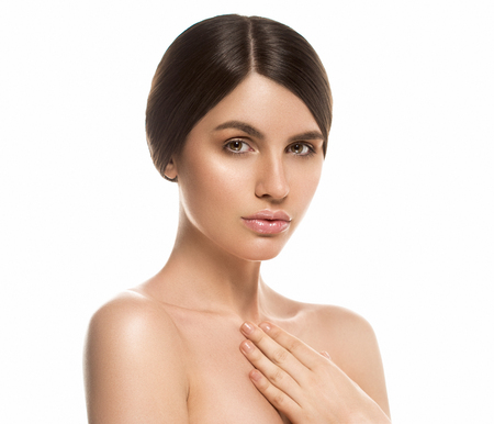 Beautiful Woman Face Portrait Beauty Skin Care Concept Beautiful beauty young female model girl touching her face skin cheeks hands fingers. Fashion Beauty Model isolated on whiteの写真素材