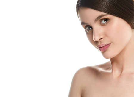 Beautiful Woman Face Portrait Beauty Skin Care Concept Beautiful beauty young female model girl touching her face skin cheeks hands fingers. Fashion Beauty Model isolated on whiteの写真素材