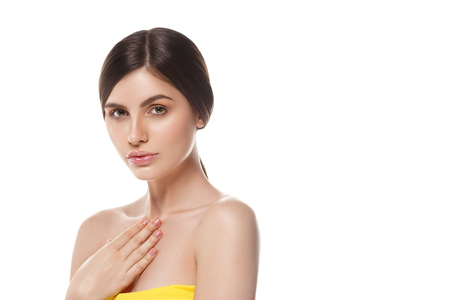 Beautiful Woman Face Portrait Beauty Skin Care Concept Beautiful beauty young female model girl touching her face skin cheeks hands fingers. Fashion Beauty Model isolated on whiteの写真素材