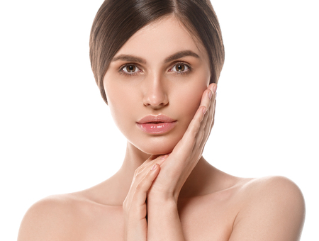 Beautiful Woman Face Portrait Beauty Skin Care Concept Beautiful beauty young female model girl touching her face skin cheeks hands fingers. Fashion Beauty Model isolated on whiteの写真素材