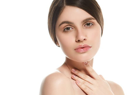Beautiful Woman Face Portrait Beauty Skin Care Concept Beautiful beauty young female model girl touching her face skin cheeks hands fingers. Fashion Beauty Model isolated on whiteの写真素材