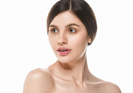 Beautiful Woman Face Portrait Beauty Skin Care Concept Beautiful beauty young female model girl touching her face skin cheeks hands fingers. Fashion Beauty Model isolated on whiteの写真素材