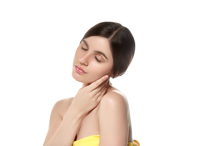 Beautiful Woman Face Portrait Beauty Skin Care Concept Beautiful beauty young female model girl touching her face skin cheeks hands fingers. Fashion Beauty Model isolated on whiteの写真素材