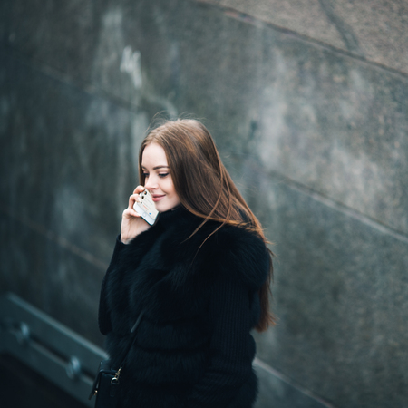 Winter Beautiful woman city portrait cold time. Outdoor shot.の写真素材