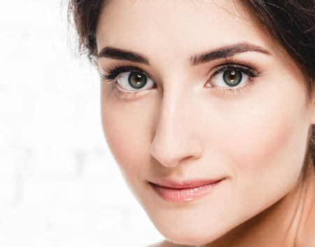 Beautiful Young  Adult Woman with Clean Fresh Skin Portrait. Facial treatment . Cosmetology , beauty and spa female modelの写真素材