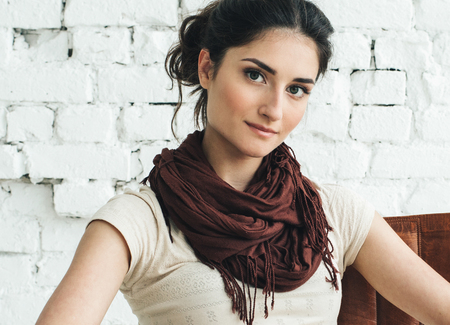 Woman portrait natural beautiful casual beautiful people. Studio shot. Stone wall background.の写真素材