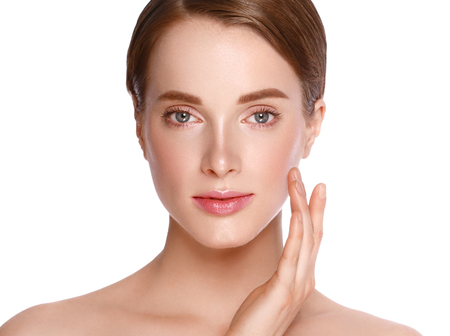 Beauty Woman face  with hand Portrait. Beautiful model Girl with Perfect Fresh Clean Skin color lips purple red. Blonde brunette short hair Youth and Skin Care Concept. Isolated on a white backgroundの写真素材