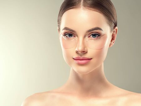 Eye mask patch cosmetic female woman face healthy skin. Studio shot.の写真素材