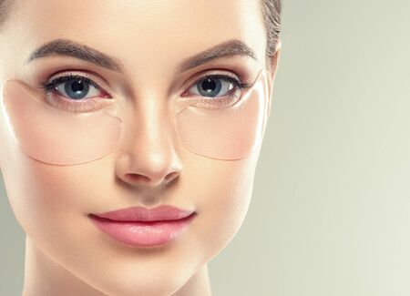 Eye mask patch cosmetic female woman face healthy skin. Studio shot.の写真素材