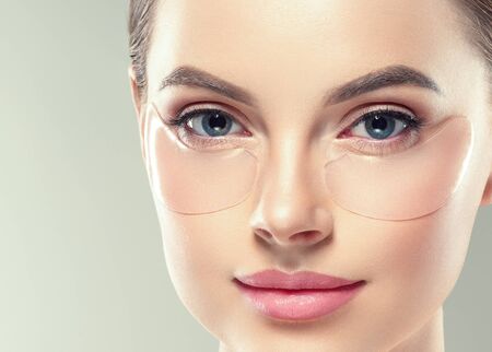 Eye mask patch cosmetic female woman face healthy skin. Studio shot.の写真素材