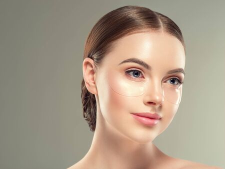 Eye mask patch cosmetic female woman face healthy skin. Studio shot.の写真素材