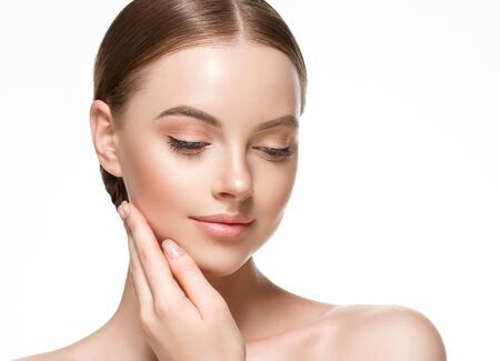 Beautiful woman female skin care healthy hair and skin close up face beauty portrait. Studio shot.の写真素材