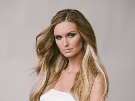 Beautiful woman long hair blonde natural portrait with beauty makeup. Studio shot.の写真素材