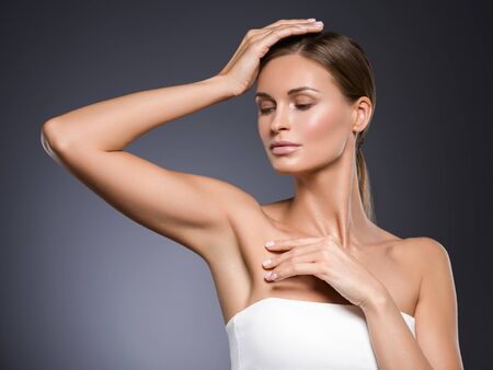 Armpits woman hands up beauty. Studio shot.の写真素材