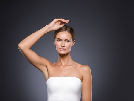 Armpits woman hands up beauty. Studio shot.の写真素材