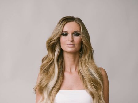 Beautiful woman long hair blonde natural portrait with beauty makeup. Studio shot.の写真素材