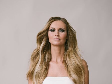 Beautiful woman long hair blonde natural portrait with beauty makeup. Studio shot.の写真素材